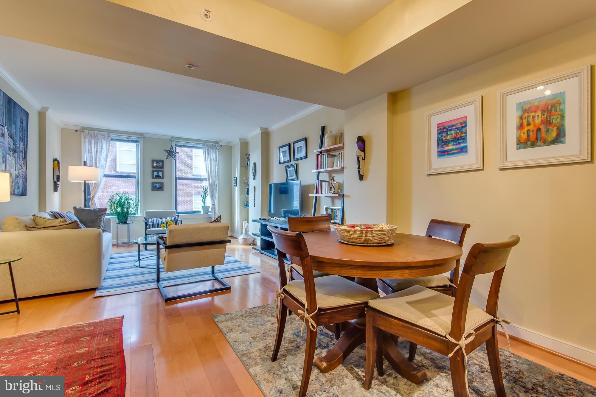 631 D Street Northwest, Unit 845 Washington, DC 20004 - Photo 4 of 30 a dining room with furniture and wooden floor