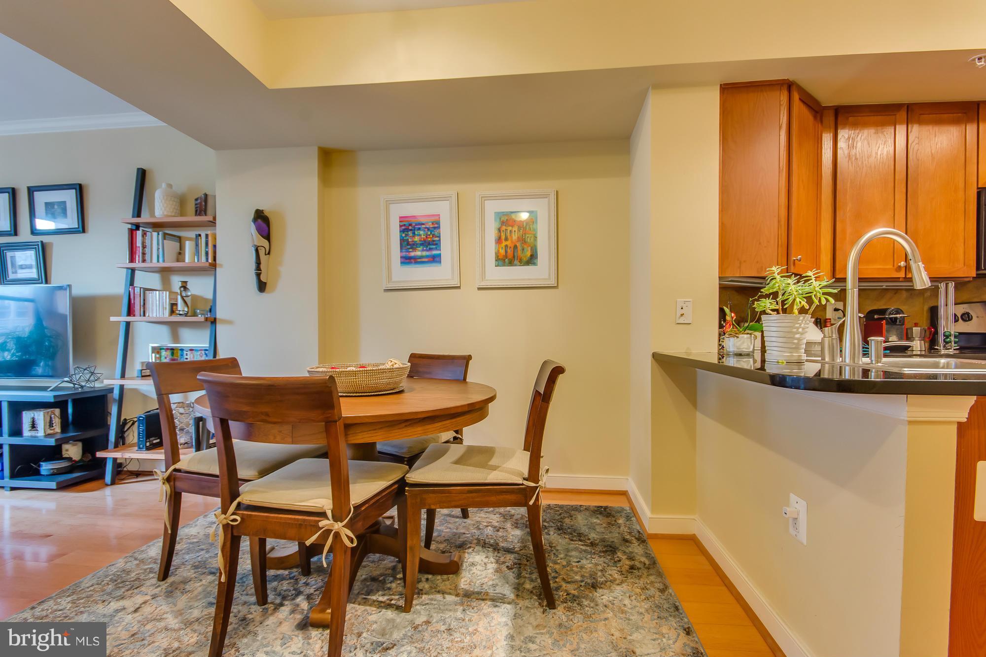 631 D Street Northwest, Unit 845 Washington, DC 20004 - Photo 5 of 30 a view of a dining room with furniture and window