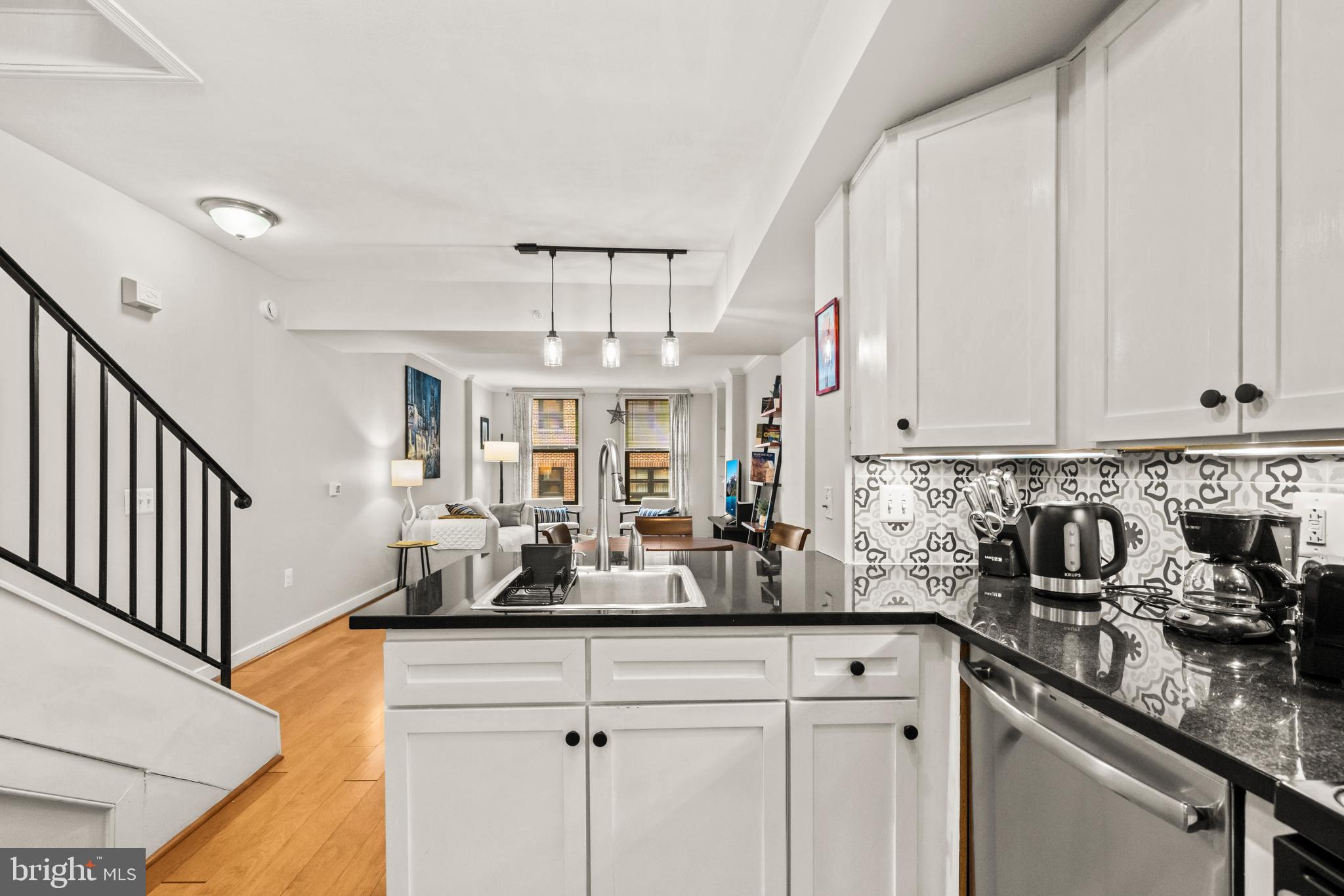 631 D Street Northwest, Unit 845 Washington, DC 20004 - Photo 7 of 84 a kitchen with stainless steel appliances granite countertop a sink a stove and cabinets
