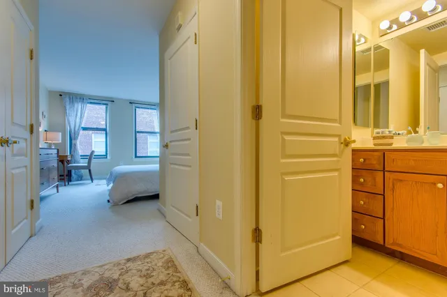 a en suite bathroom with a sink and a mirror