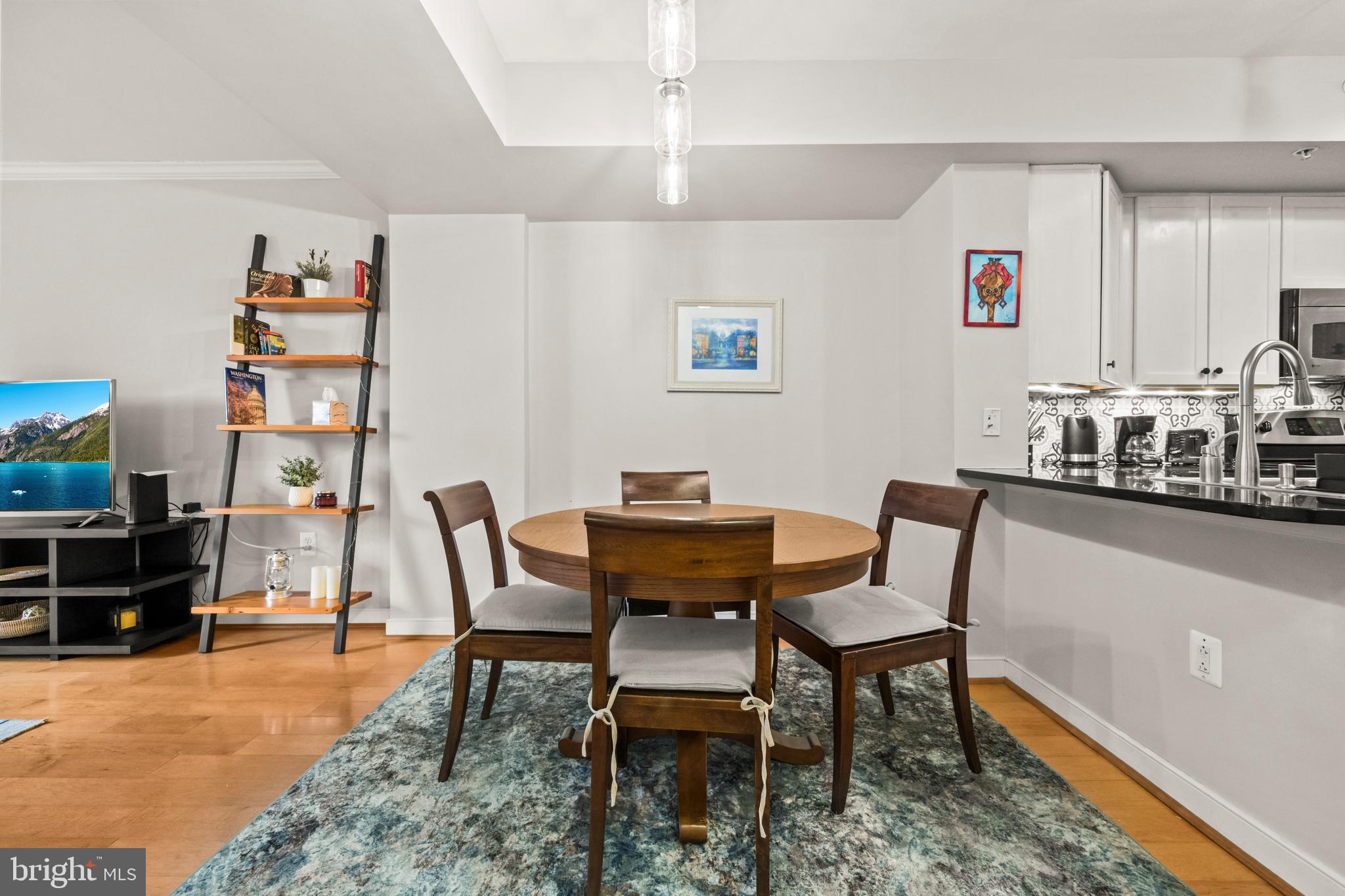 631 D Street Northwest, Unit 845 Washington, DC 20004 - Photo 10 of 84 a dining room with furniture and wooden floor