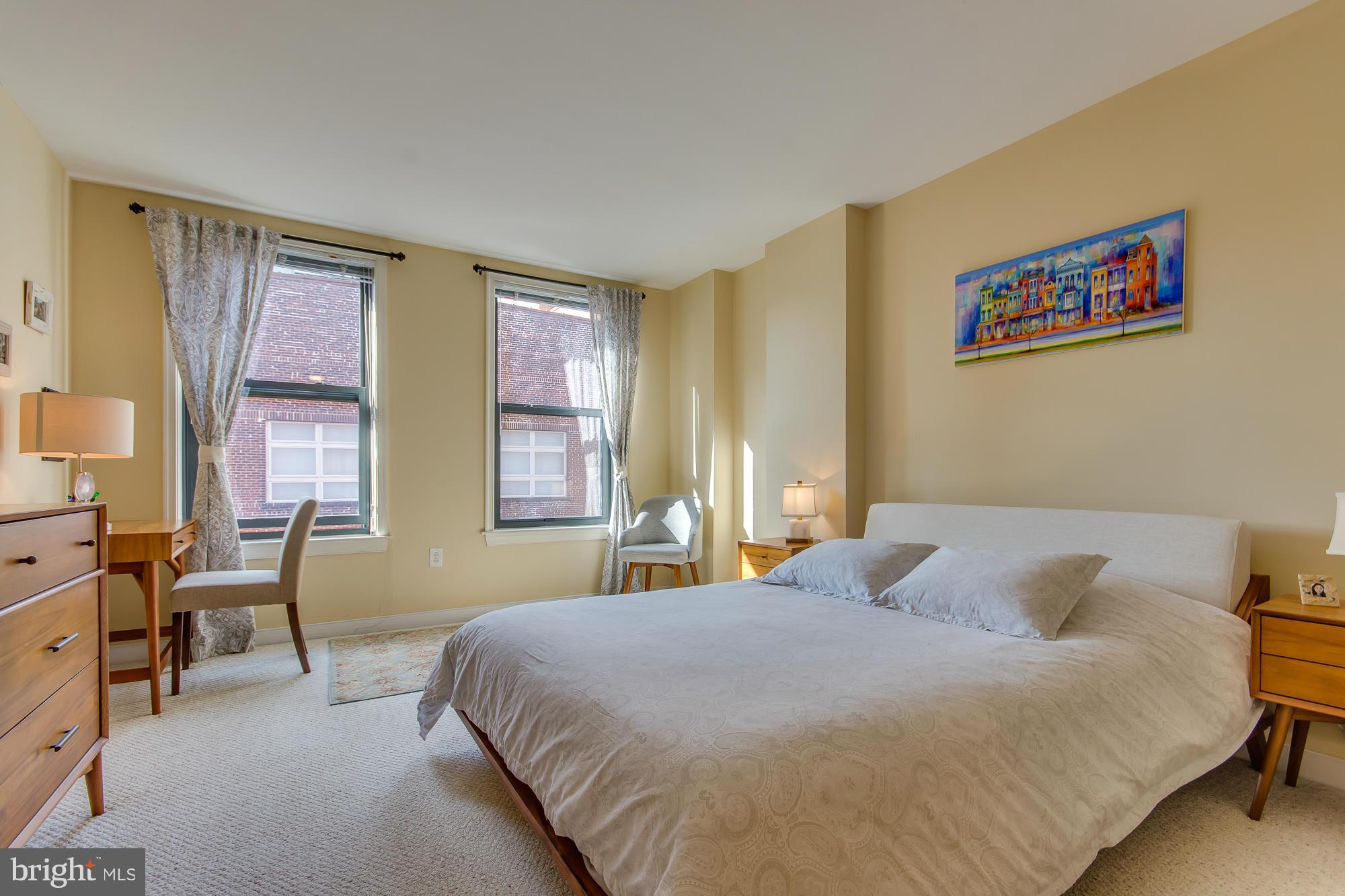 631 D Street Northwest, Unit 845 Washington, DC 20004 - Photo 10 of 30 a bedroom with a bed and wooden floor