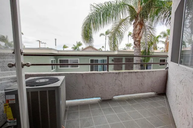a view of balcony with a sink and outdoor seating