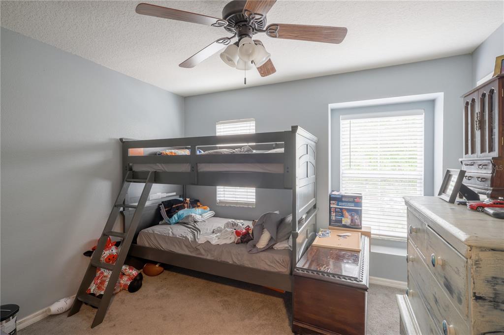 6925 Marble Fawn Place Riverview, FL 33578 - Photo 17 of 21 a bedroom with furniture and a window