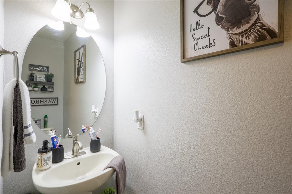 6925 Marble Fawn Place Riverview, FL 33578 - Photo 19 of 21 a bathroom with a sink and a mirror
