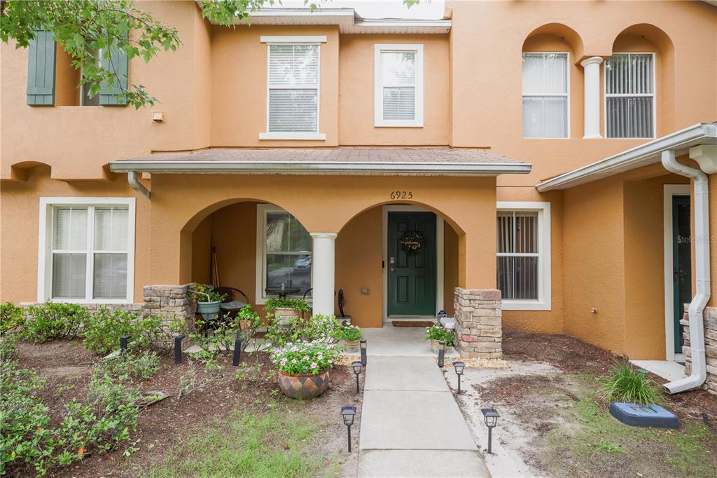 6925 Marble Fawn Place Riverview, FL 33578 - Photo 2 of 21 a front view of a house with garden