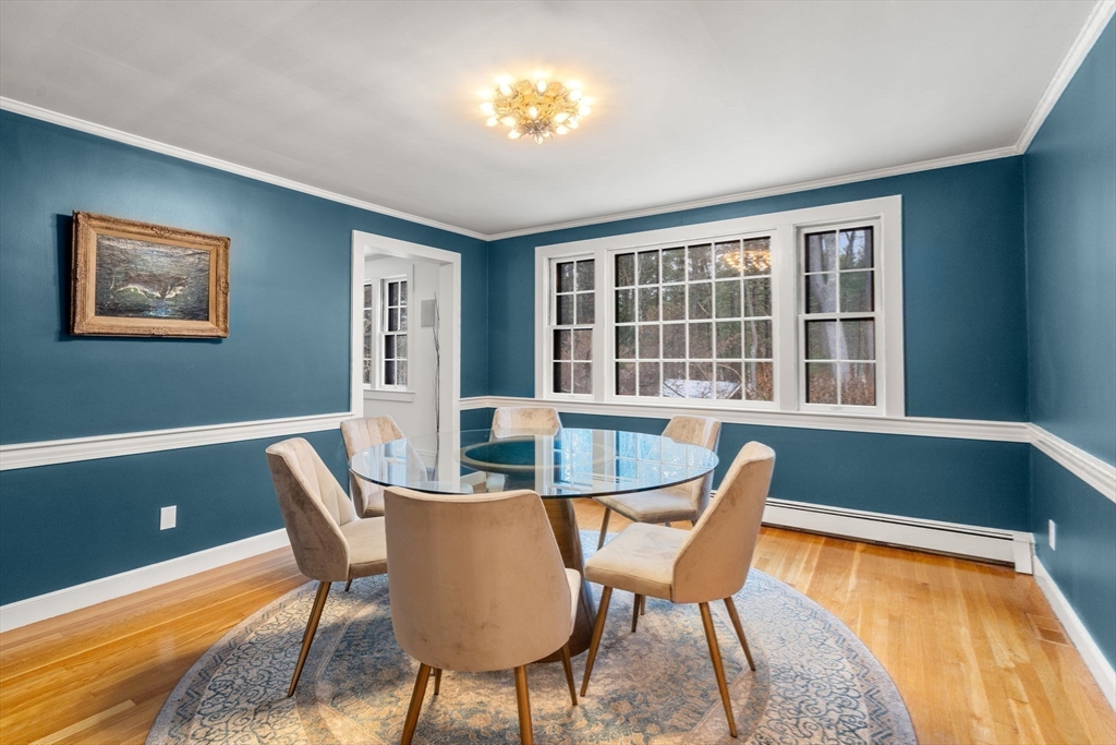 56 Isaac Davis Road Concord, MA 01742 - Photo 12 of 42 a dining room with furniture and window