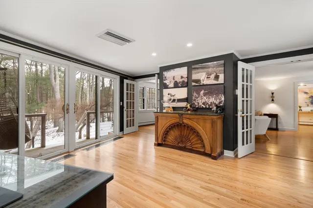 a living room with furniture and large windows
