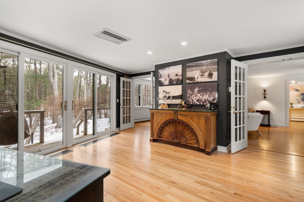 56 Isaac Davis Road Concord, MA 01742 - Photo 16 of 42 a living room with furniture and large windows