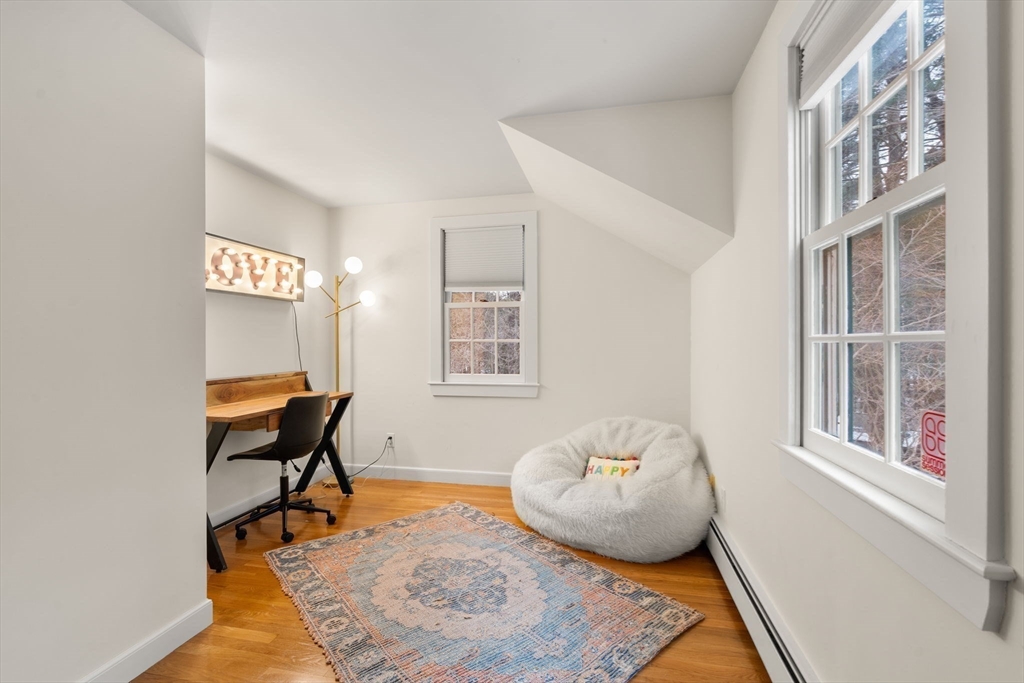 56 Isaac Davis Road Concord, MA 01742 - Photo 24 of 42 a living room with furniture and a window