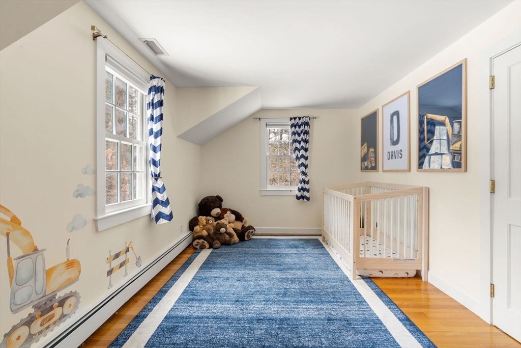56 Isaac Davis Road Concord, MA 01742 - Photo 25 of 42 a bedroom with furniture and a window