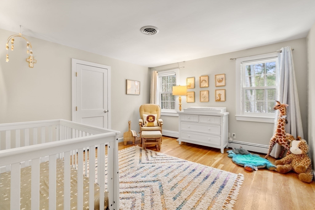 56 Isaac Davis Road Concord, MA 01742 - Photo 27 of 42 a bedroom with furniture and a window