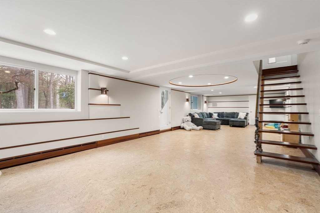 56 Isaac Davis Road Concord, MA 01742 - Photo 28 of 42 a view of a livingroom with furniture and a window