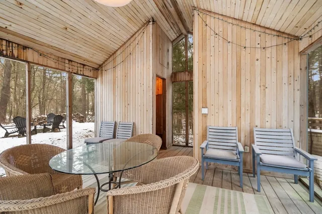 a dining room with furniture and wooden floor