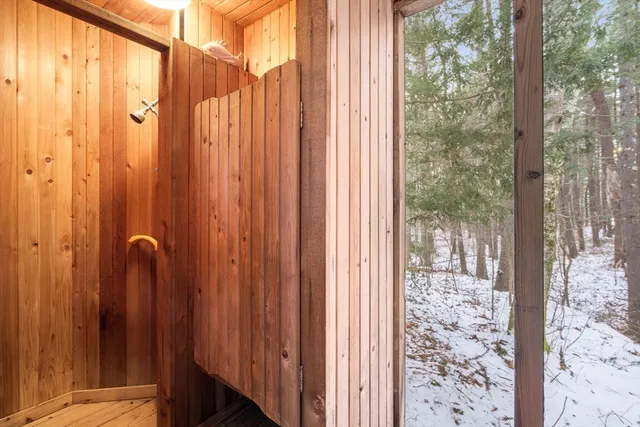 a view of a bathroom with shower curtain