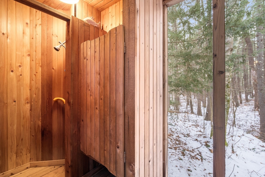 56 Isaac Davis Road Concord, MA 01742 - Photo 37 of 42 a view of a bathroom with shower curtain