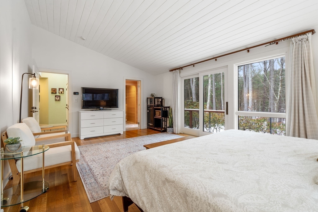 56 Isaac Davis Road Concord, MA 01742 - Photo 10 of 42 a bedroom with a bed and a large window