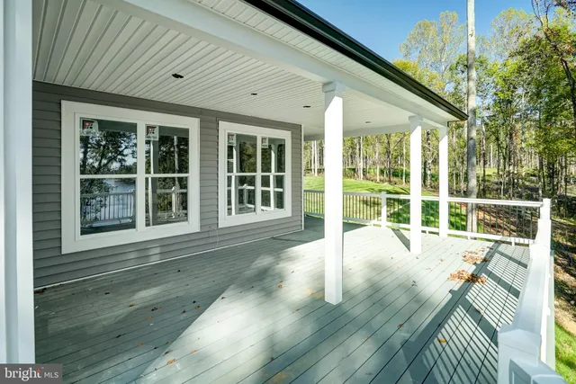 a view of an house with wooden floor and windows