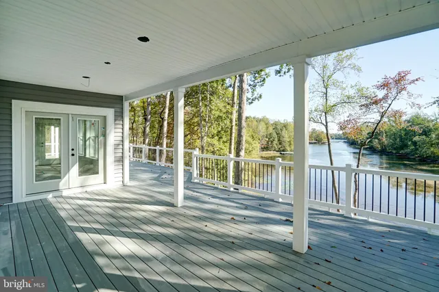 a view of a balcony with wooden floor