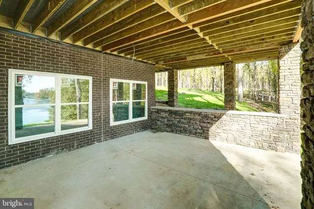 a view of swimming pool with a patio