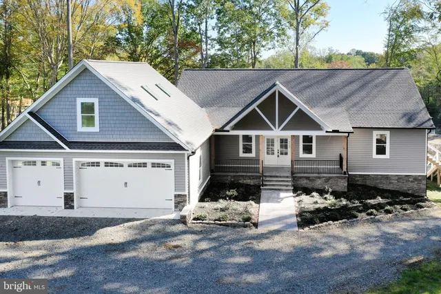 a view of a house with brick walls and a large window