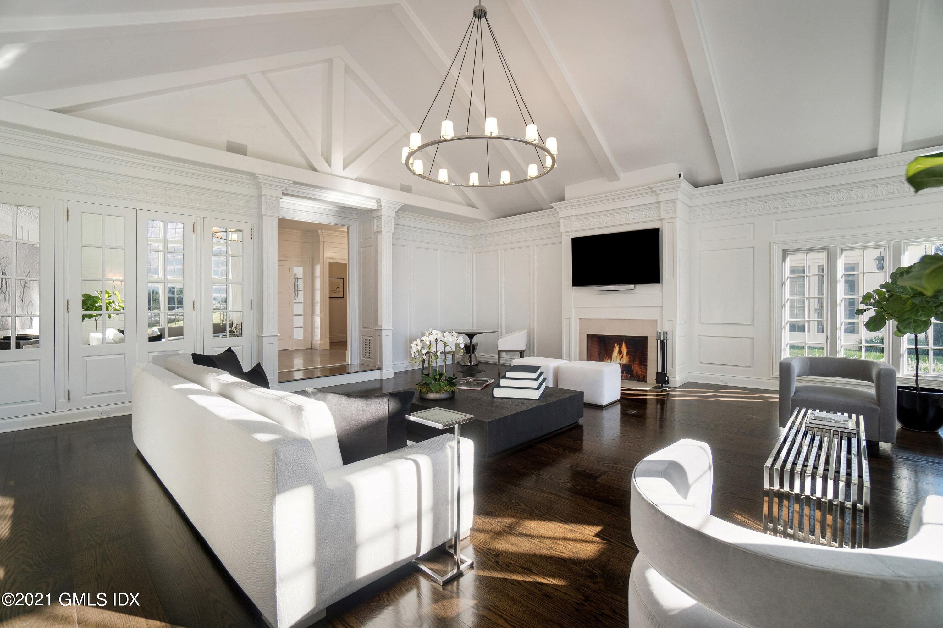 60 Round Hill Road Greenwich, CT 06831 - Photo 14 of 34 a living room with fireplace furniture and a flat screen tv