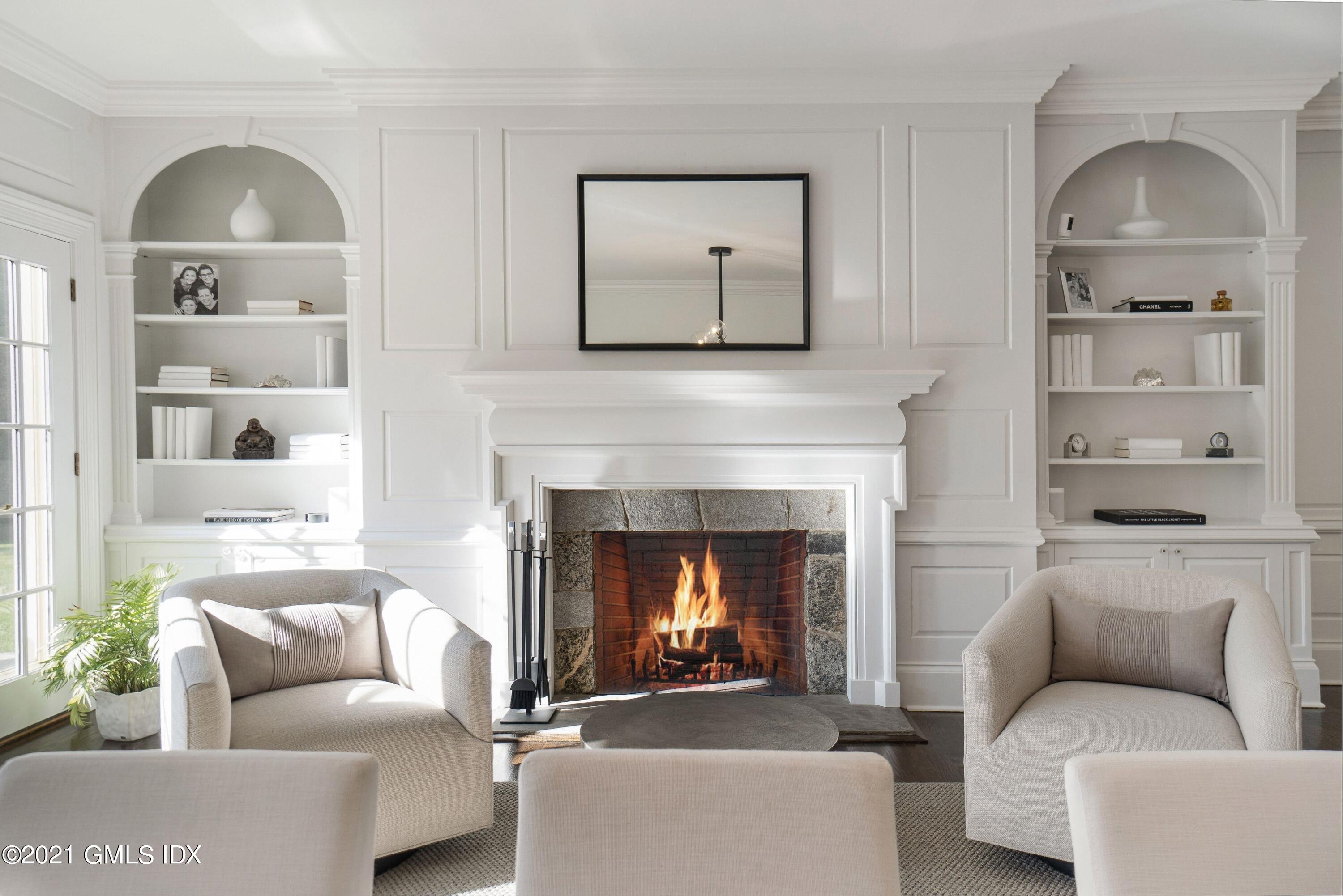 60 Round Hill Road Greenwich, CT 06831 - Photo 17 of 34 a living room with furniture and a fireplace