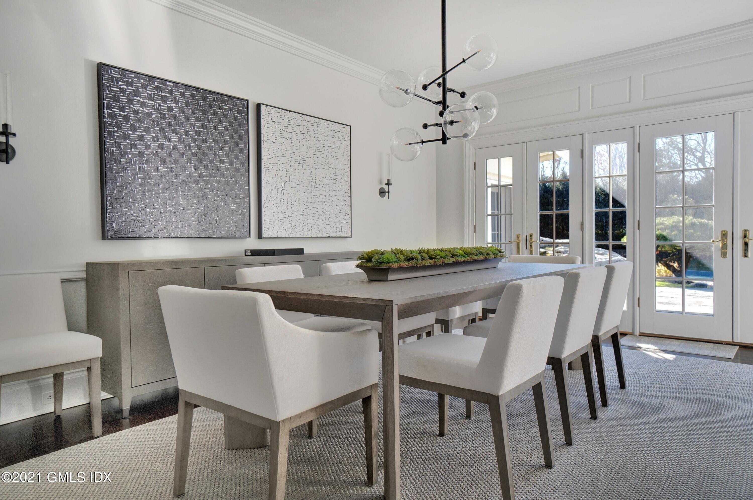 60 Round Hill Road Greenwich, CT 06831 - Photo 18 of 34 a view of a dining room with furniture wooden floor and chandelier