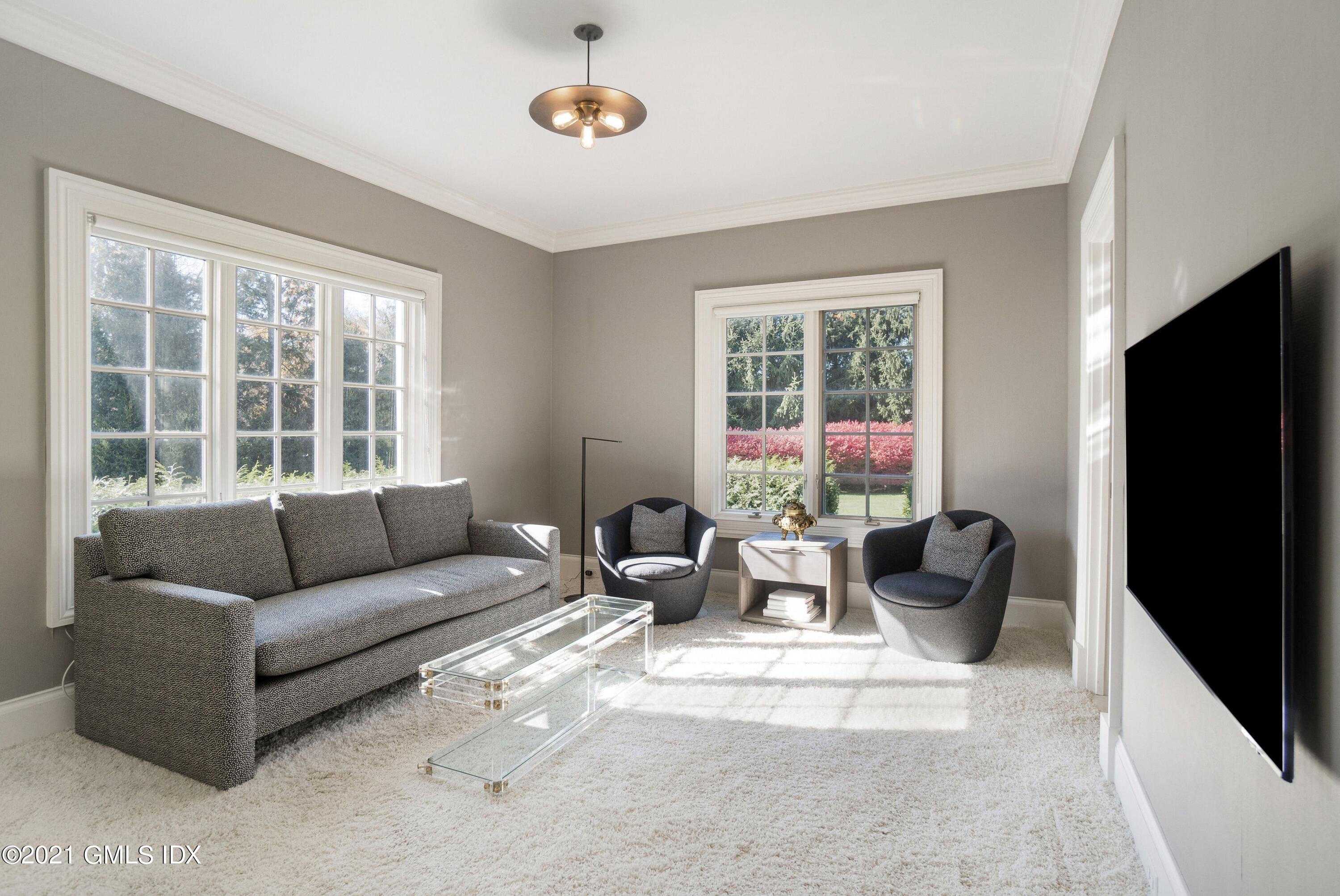 60 Round Hill Road Greenwich, CT 06831 - Photo 29 of 34 a living room with furniture and a large window