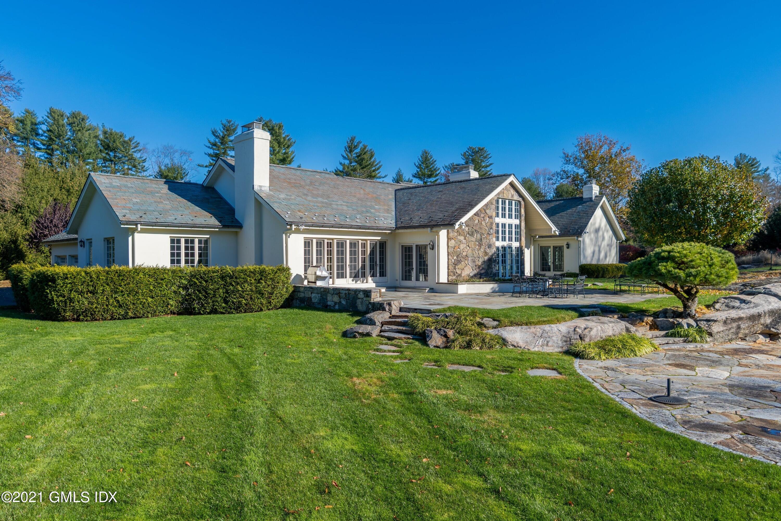 60 Round Hill Road Greenwich, CT 06831 - Photo 3 of 34 a view of house with garden