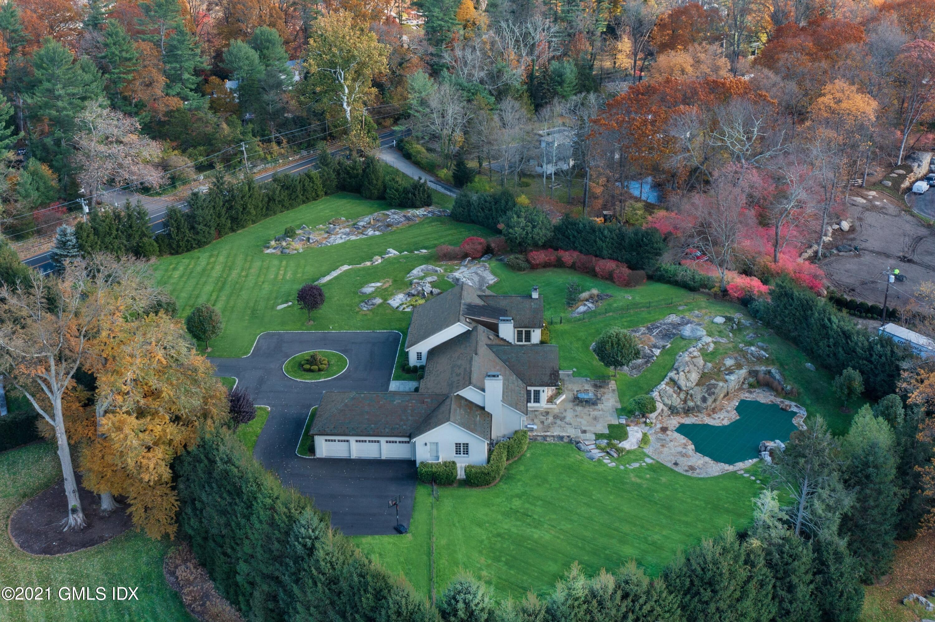 60 Round Hill Road Greenwich, CT 06831 - Photo 7 of 34 an aerial view of a house with outdoor space