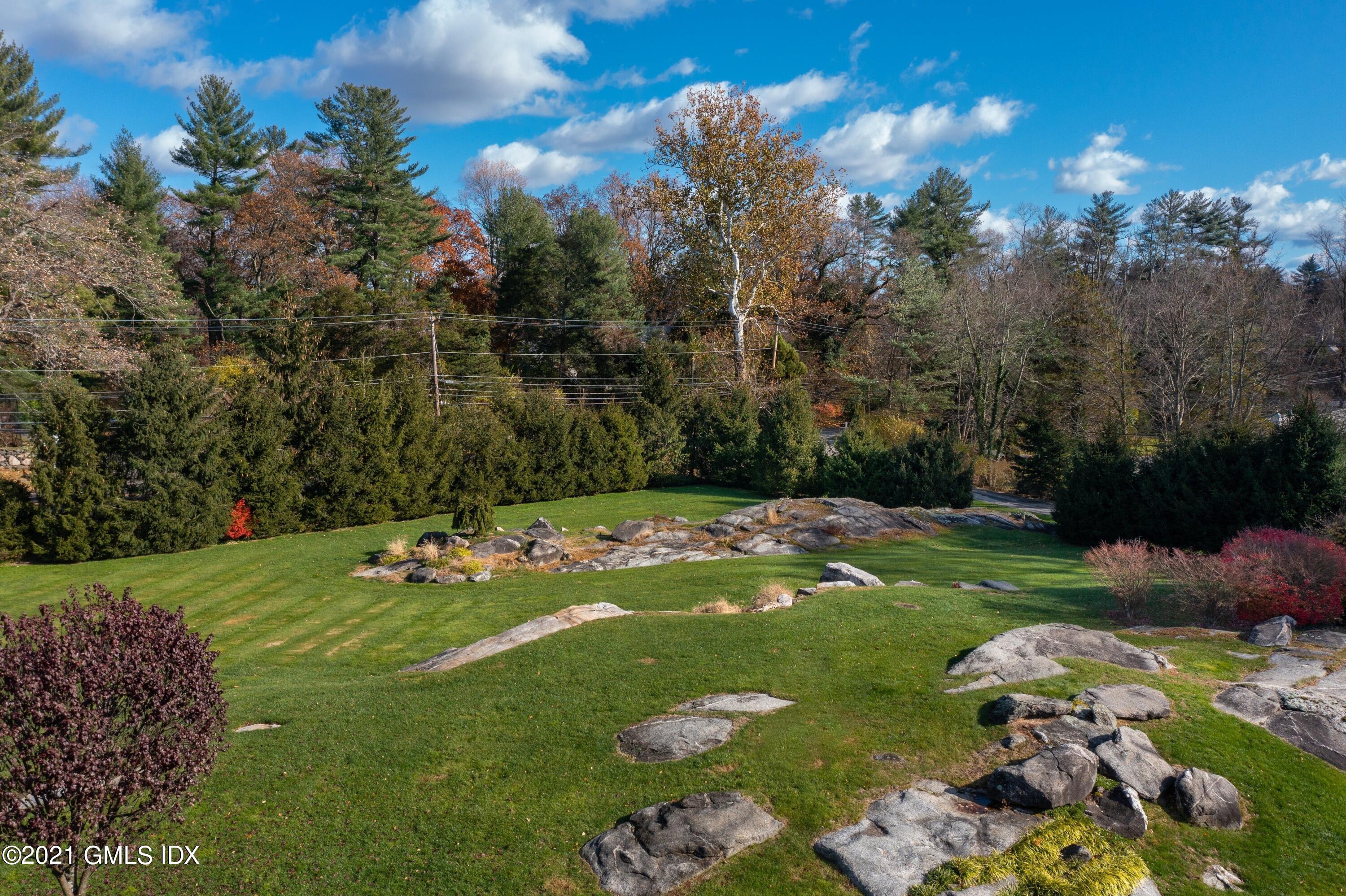 60 Round Hill Road Greenwich, CT 06831 - Photo 8 of 34 a view of a golf course with a yard