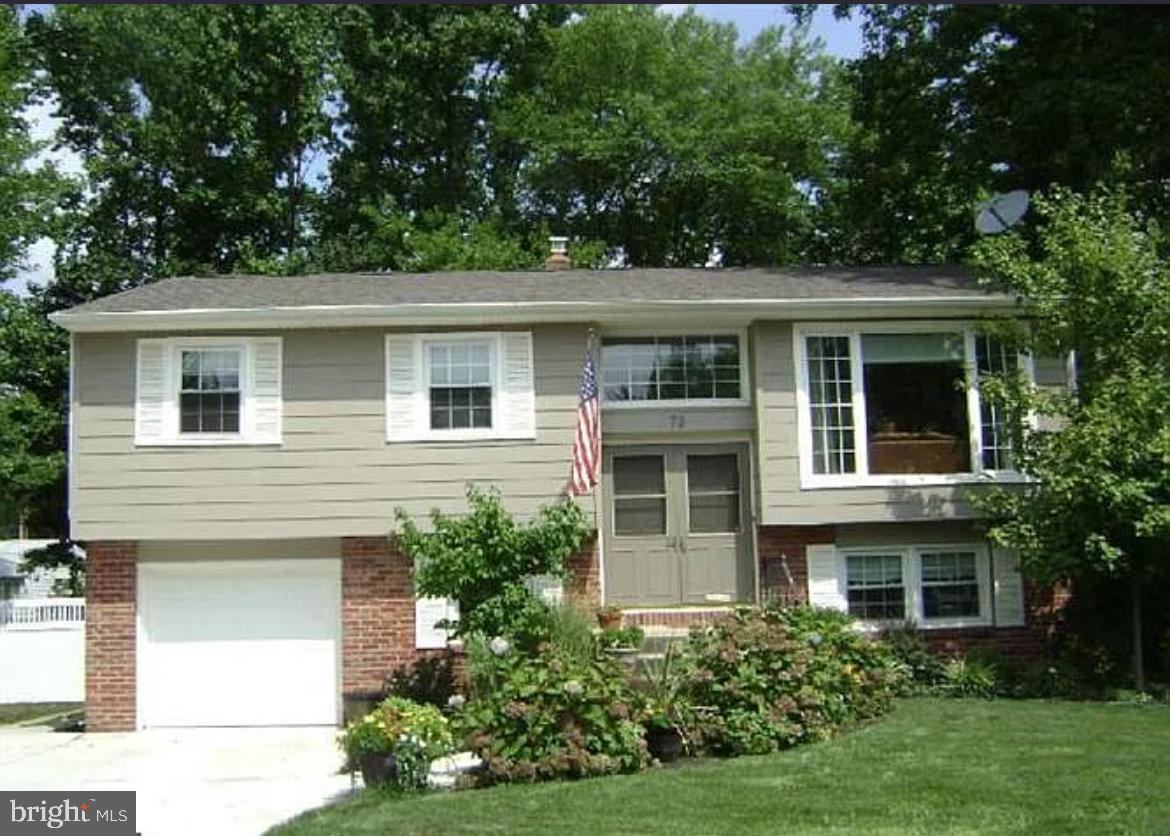 73 Greenvale Road Cherry Hill, NJ 08034 - Photo 1 of 15 a front view of a house with a yard