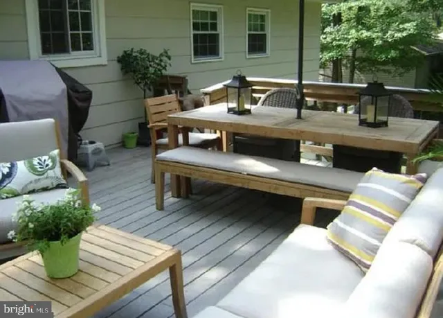 a view of a dinning table and chairs in the patio