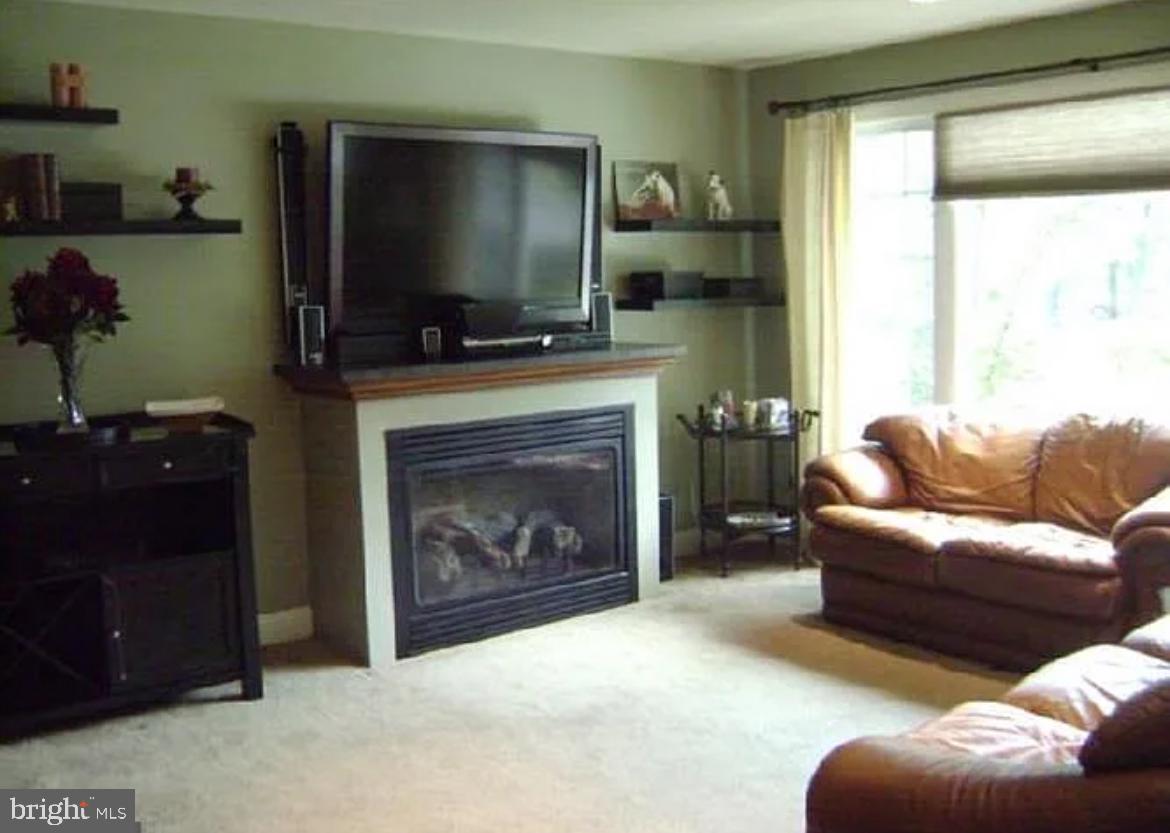 73 Greenvale Road Cherry Hill, NJ 08034 - Photo 4 of 15 a living room with furniture and a fireplace