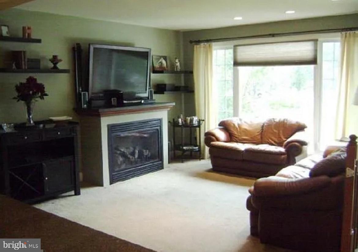 73 Greenvale Road Cherry Hill, NJ 08034 - Photo 5 of 15 a living room with furniture and a fireplace