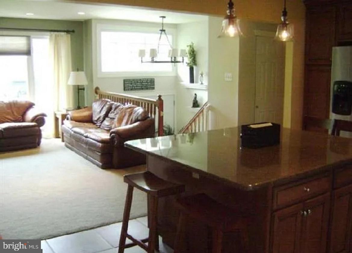 73 Greenvale Road Cherry Hill, NJ 08034 - Photo 6 of 15 a living room with furniture and a chandelier