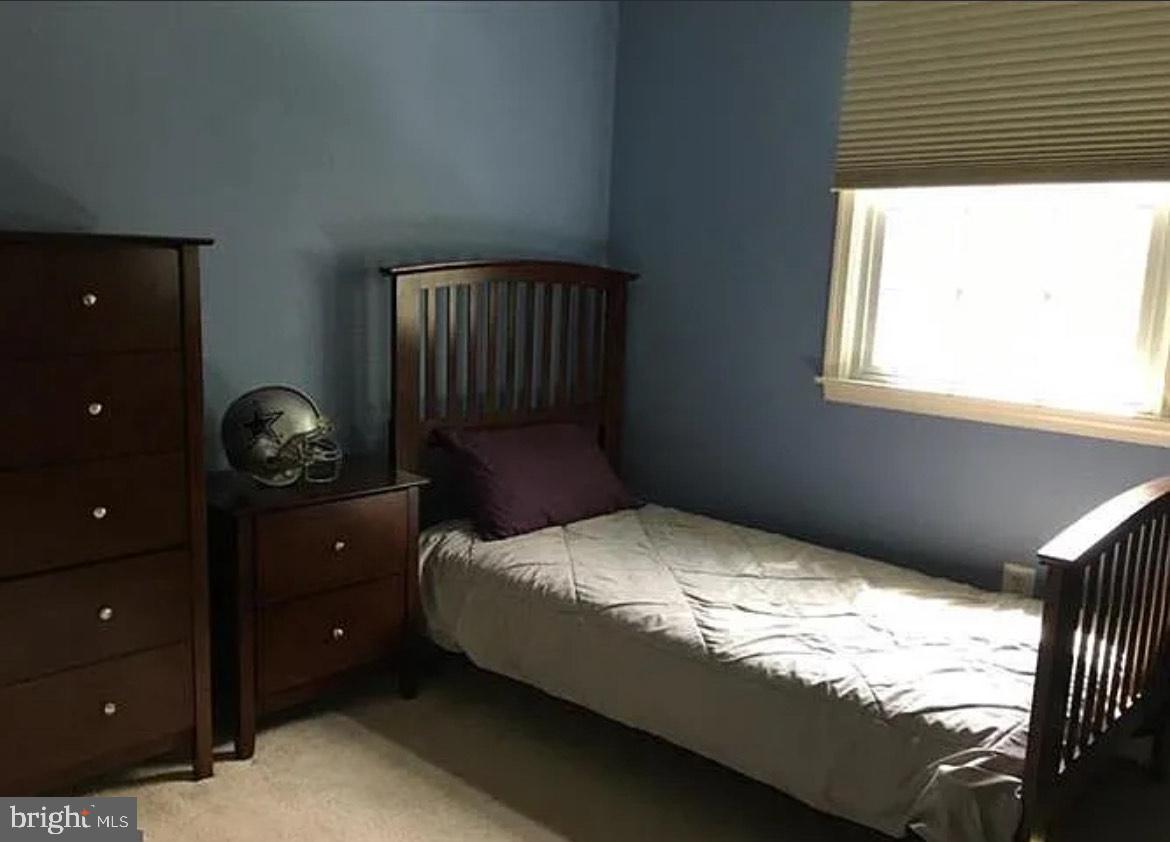 73 Greenvale Road Cherry Hill, NJ 08034 - Photo 7 of 15 a bedroom with a bed and a window