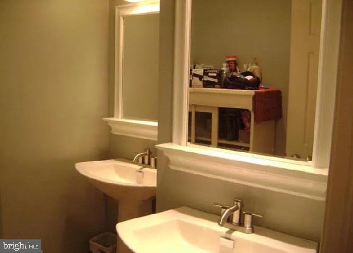 73 Greenvale Road Cherry Hill, NJ 08034 - Photo 10 of 15 a bathroom with a sink and a mirror