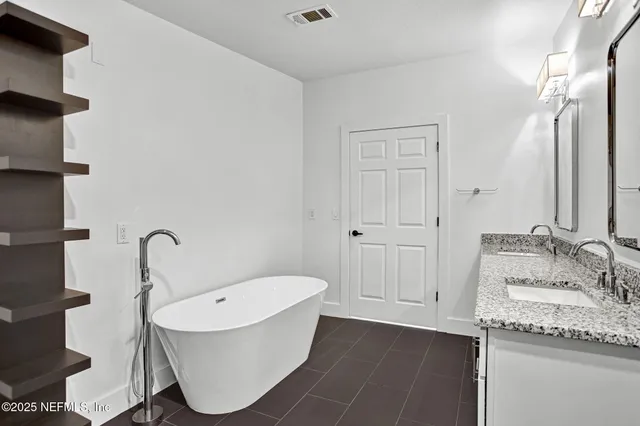 a bathroom with a shower toilet and sink