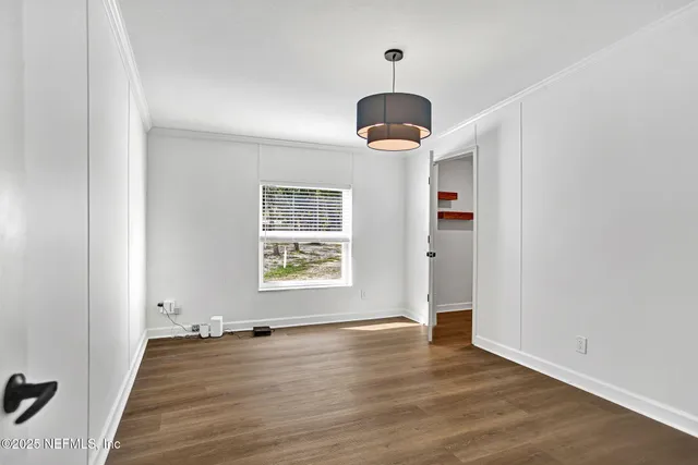 a bathroom with a granite countertop sink toilet mirror and shower