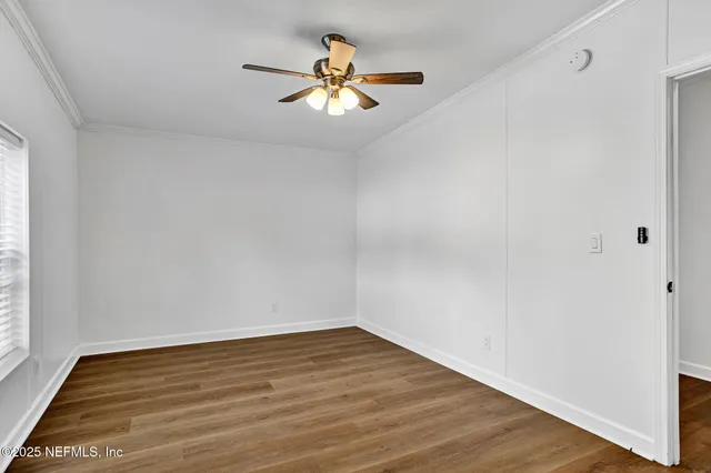 a view of storage and utility room with wooden floor