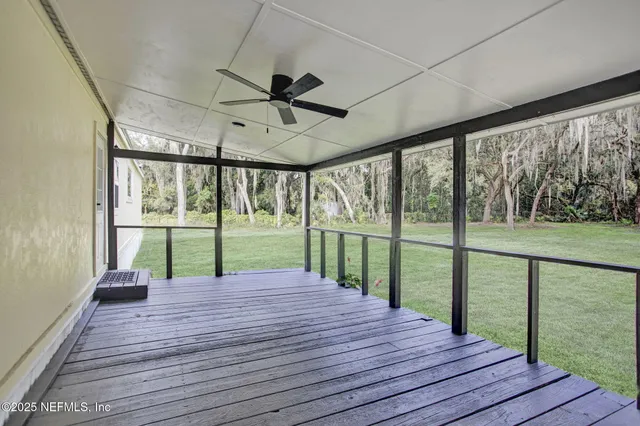 a view of house with backyard