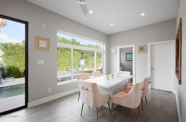 a view of a dining room with furniture window and wooden floor