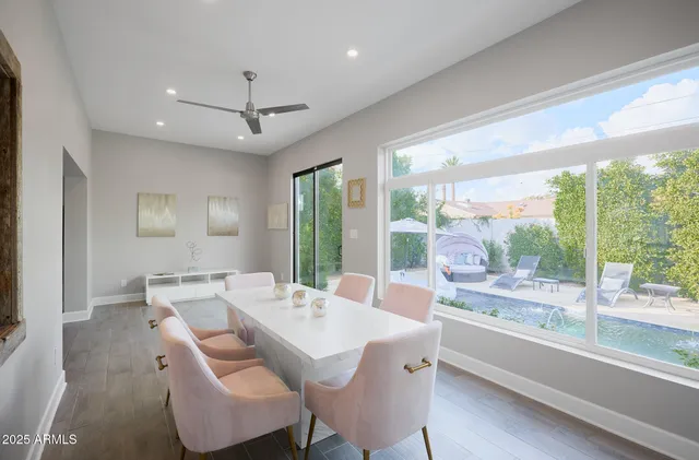 a view of a dining room with furniture window and outside view