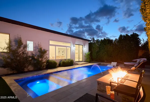 a view of swimming pool with seating space