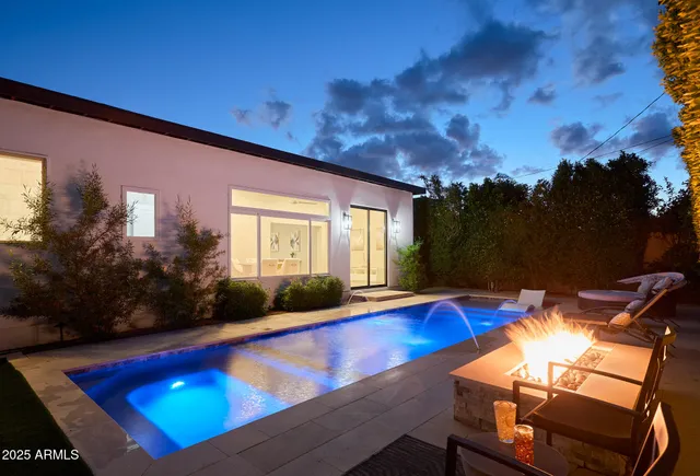 a view of swimming pool with seating space