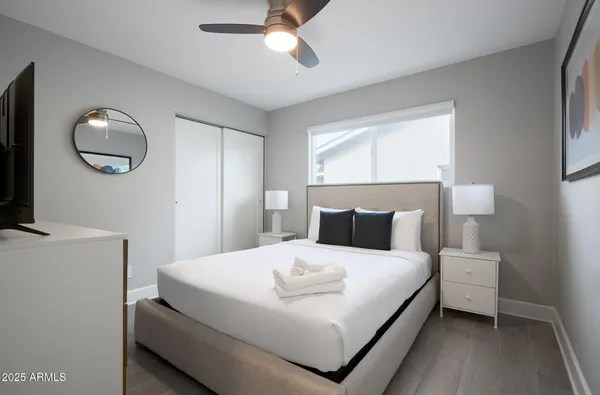 a bedroom with a bed and window