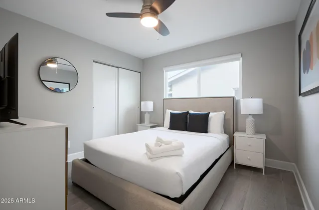 a bedroom with a bed and window