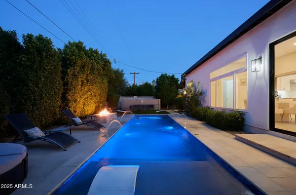 a view of swimming pool with lounge chair